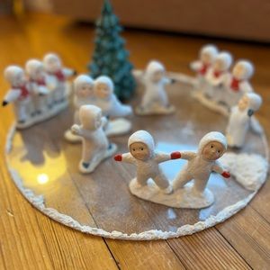 Set of Holiday Snowbabies. 7 figurine groupings plus ice skating pond included.